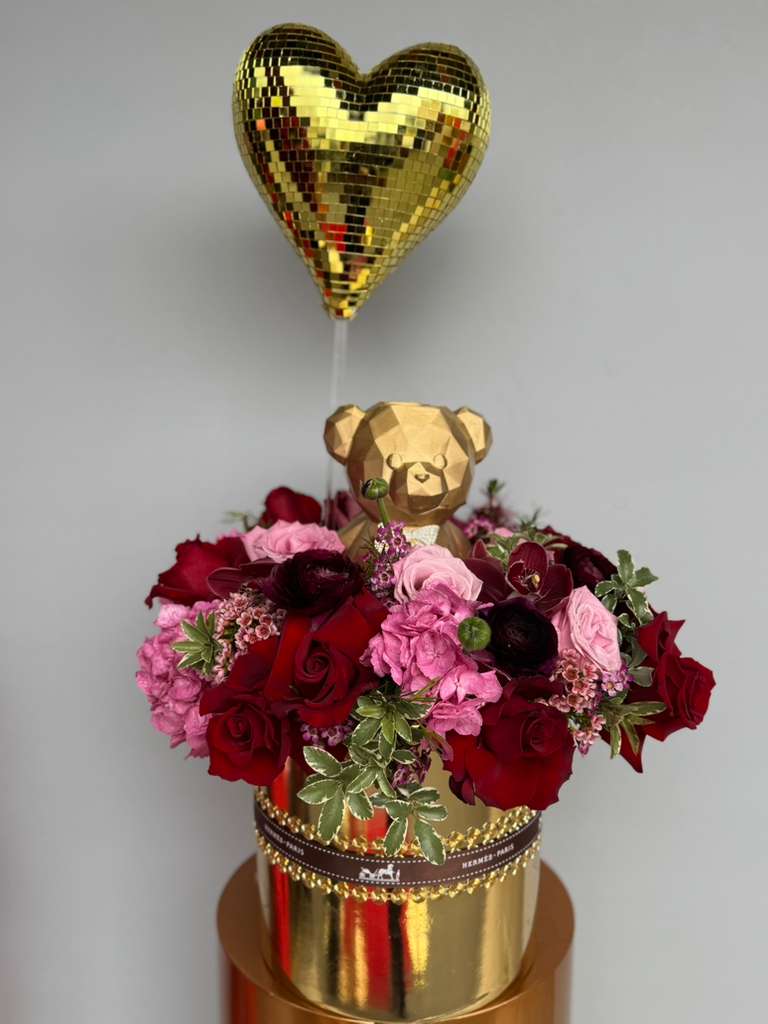 Golden Heart Blooms  - A stunning gold bear, heart and base filled with lush flowers- the perfect golden gift to capture love and admiration. 