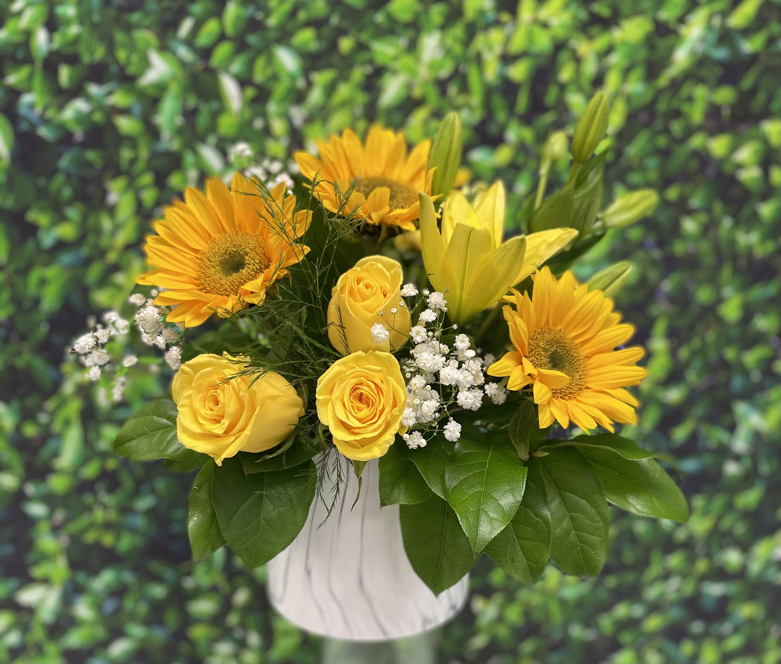 Sunny days  - A stunning white marble keepsake vase with fresh greenery yellow roses sunflowers and a touch of babies breath