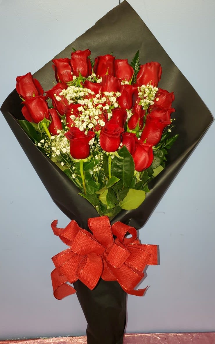 Bouquet of red roses with white baby's breath and a red ribbon