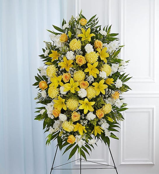 Deepest Sympathies Yellow Standing Spray - During times of loss, it can be hard to express exactly what you are feeling in your heart. Let this beautiful standing spray arrangement of fresh yellow blooms, which signify friendship, and white blooms, which signify remembrance, help you convey your care and concern when words alone can't. 