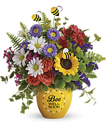 Mixed bouquet in a yellow vase with bee decorations