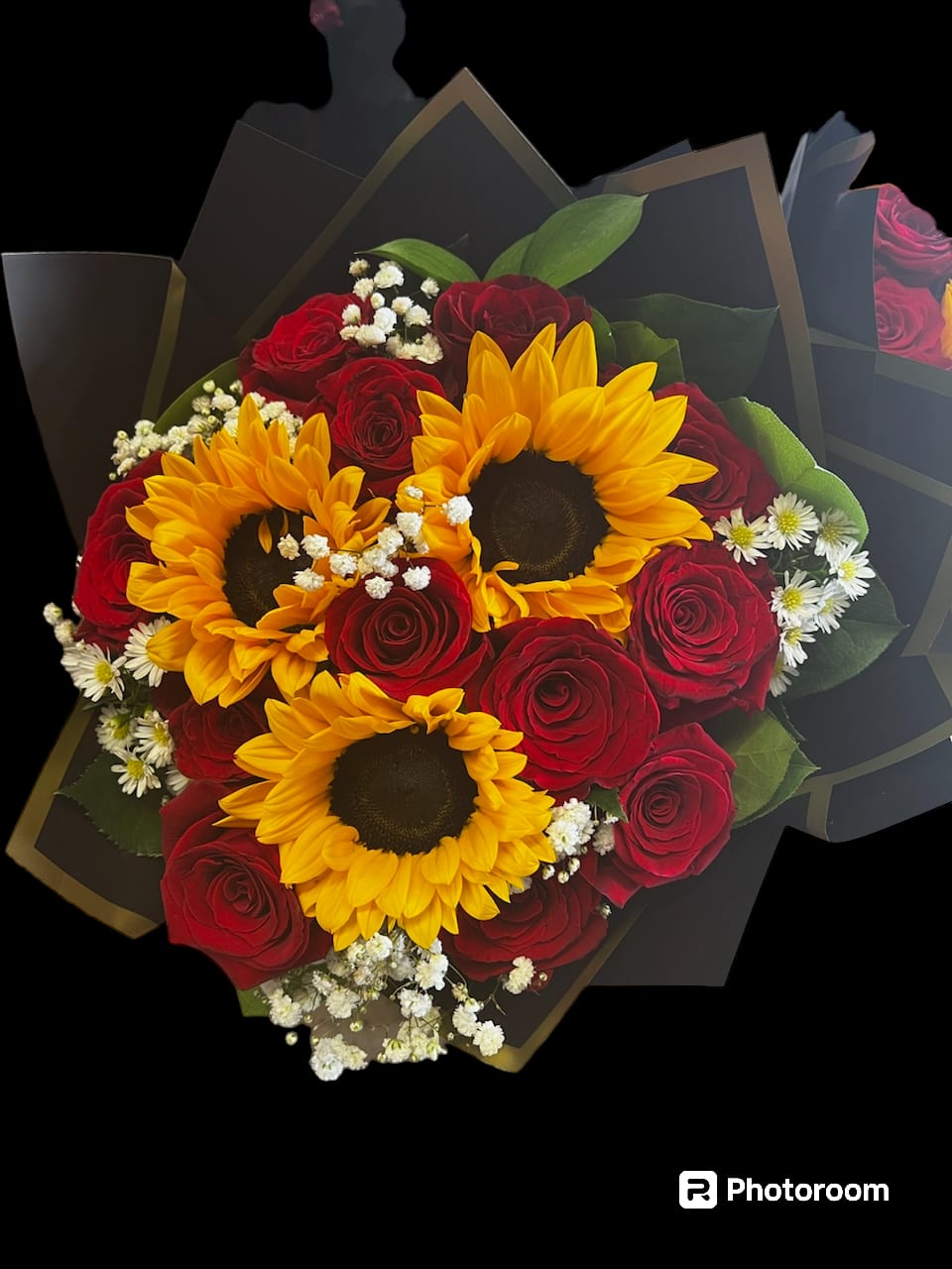 Bouquet of red roses and yellow sunflowers with white filler flowers