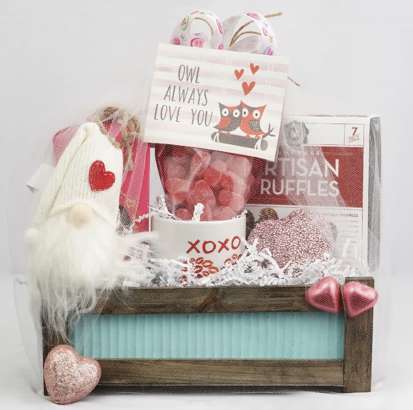 Gift basket with a love note, socks, and heart decorations