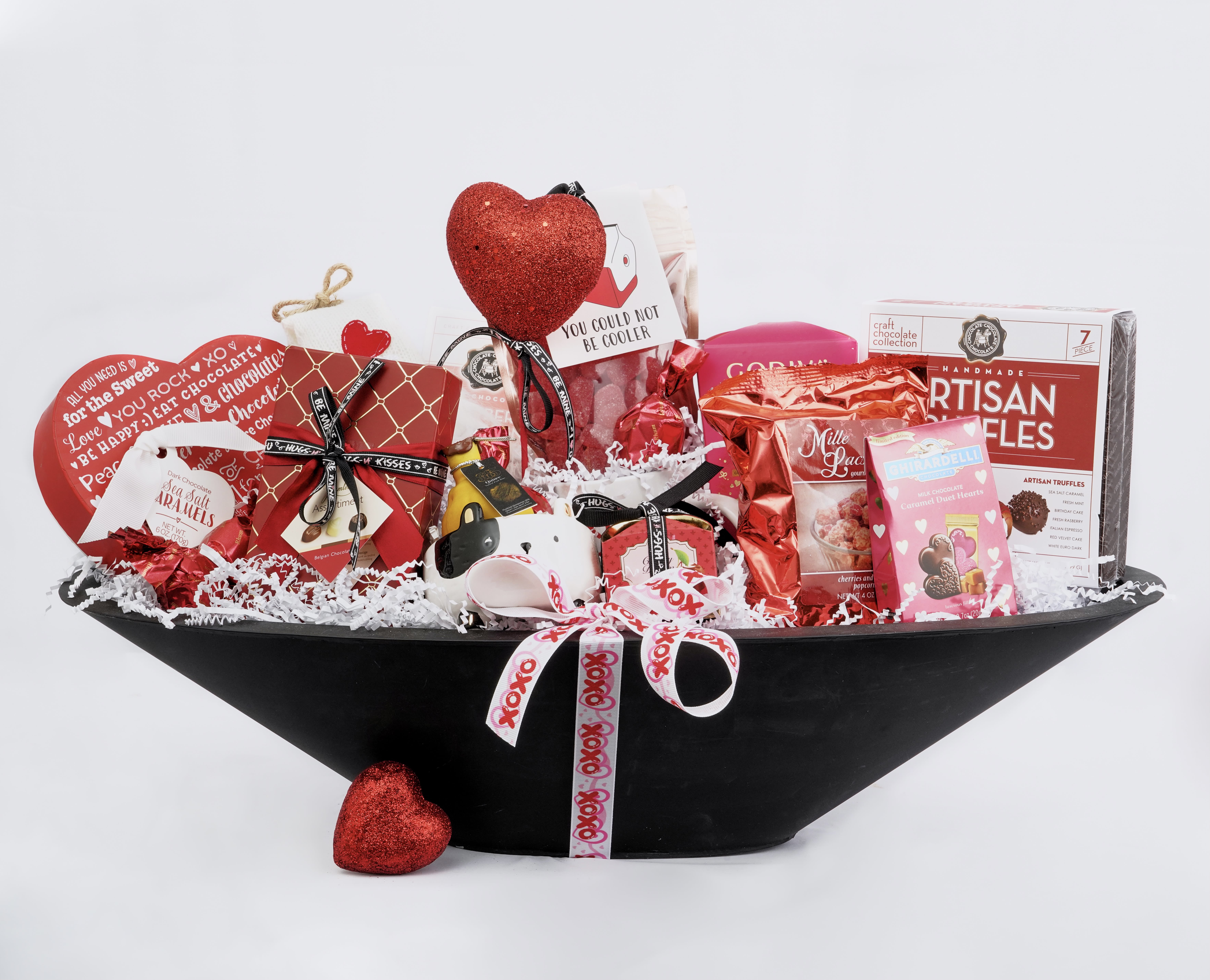 Heart-themed gift basket with chocolates and red decorations