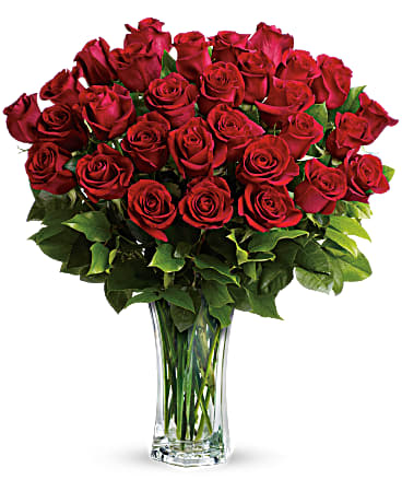 Bouquet of red roses in a clear glass vase