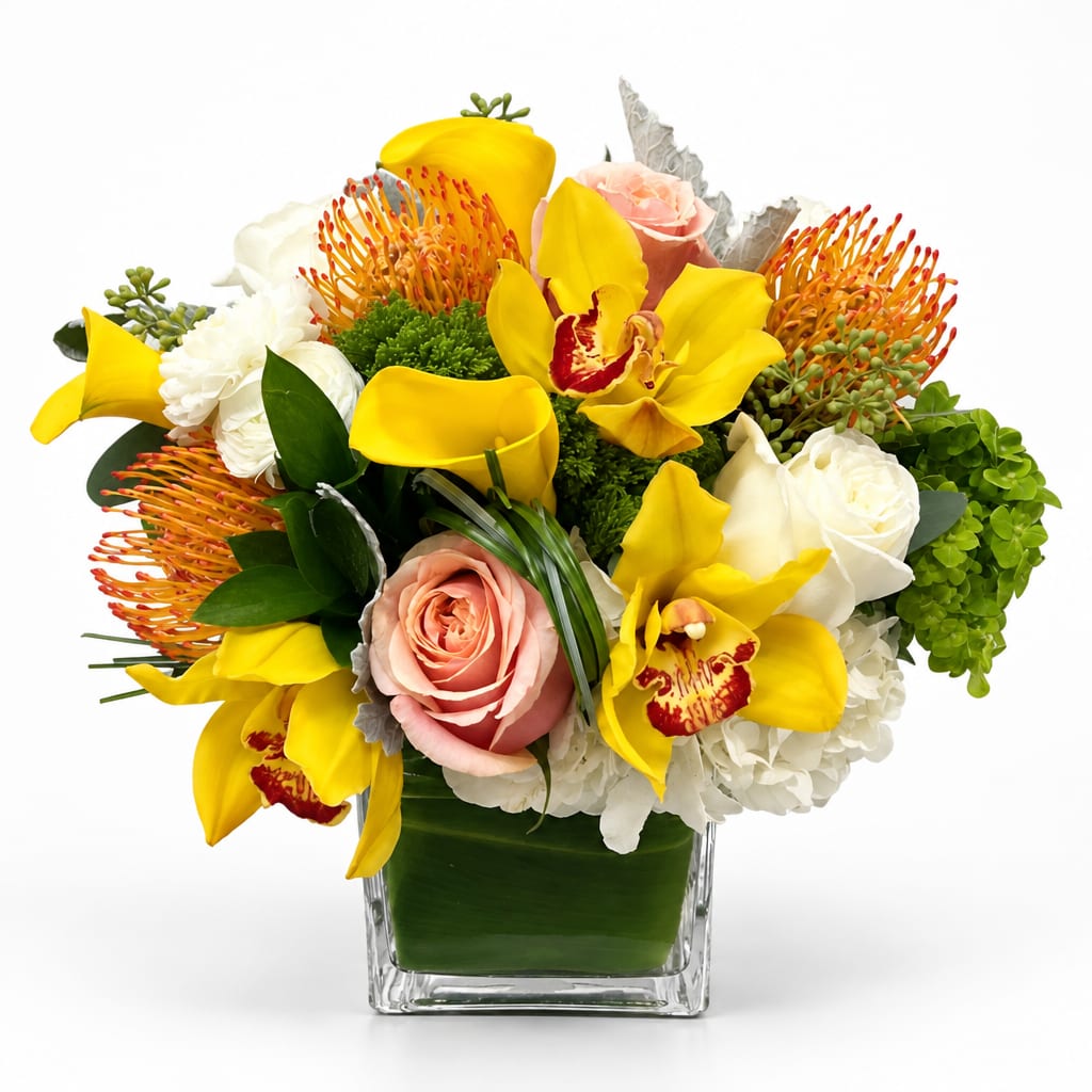 Yellow orchids and roses arranged in a square glass vase