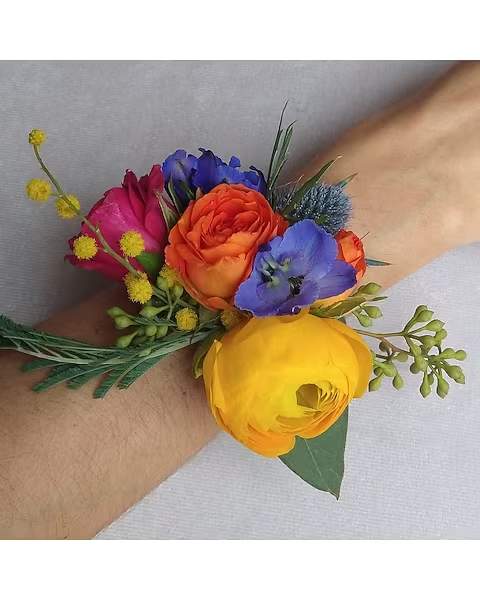 Bright Colors Wrist Corsage - Perfect for weddings, proms, engagements, or any formal event, this corsage is designed to sit comfortably on the wrist while making a stylish statement. Its timeless color combination complements a wide range of outfits and themes. 