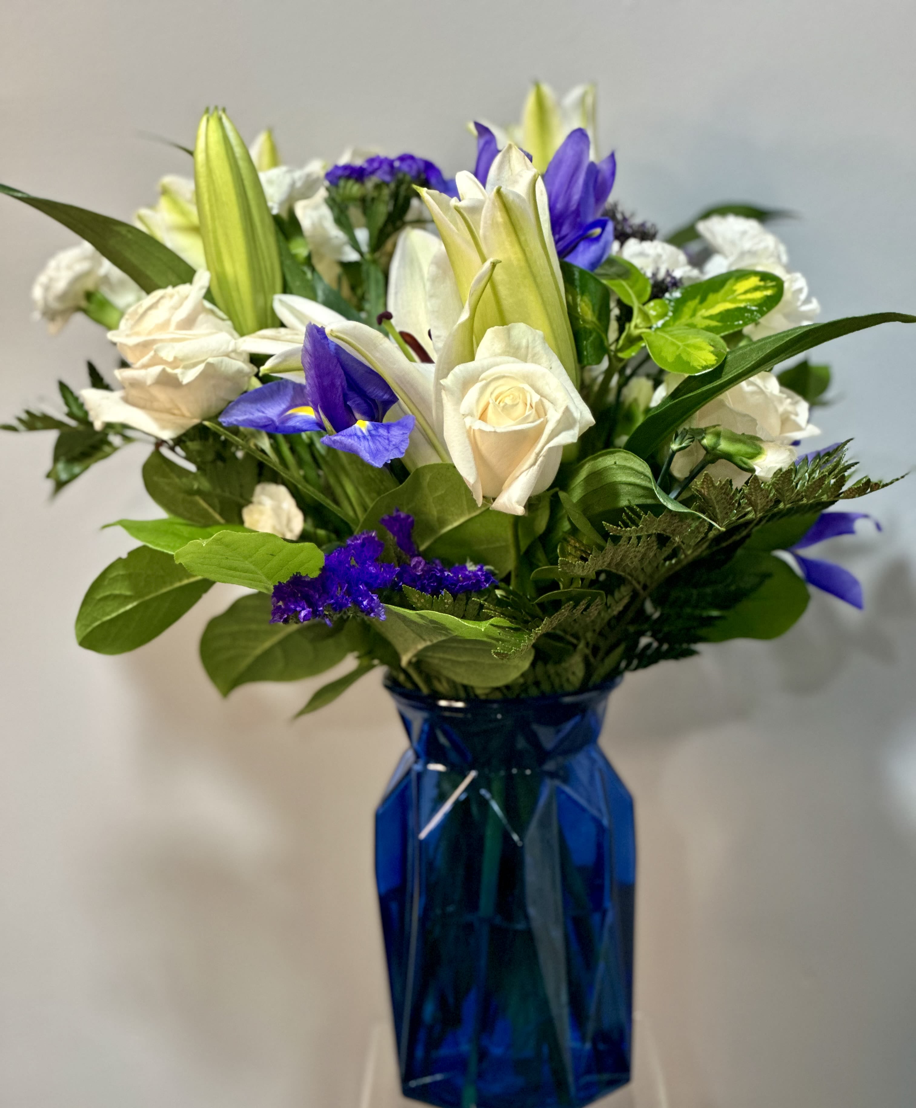 Beyond Blue by Petals 2 Go - Designed to bring a sense of calmness and serenity with white blooms and bold florals to deliver just the right sentiment for any reason or season.