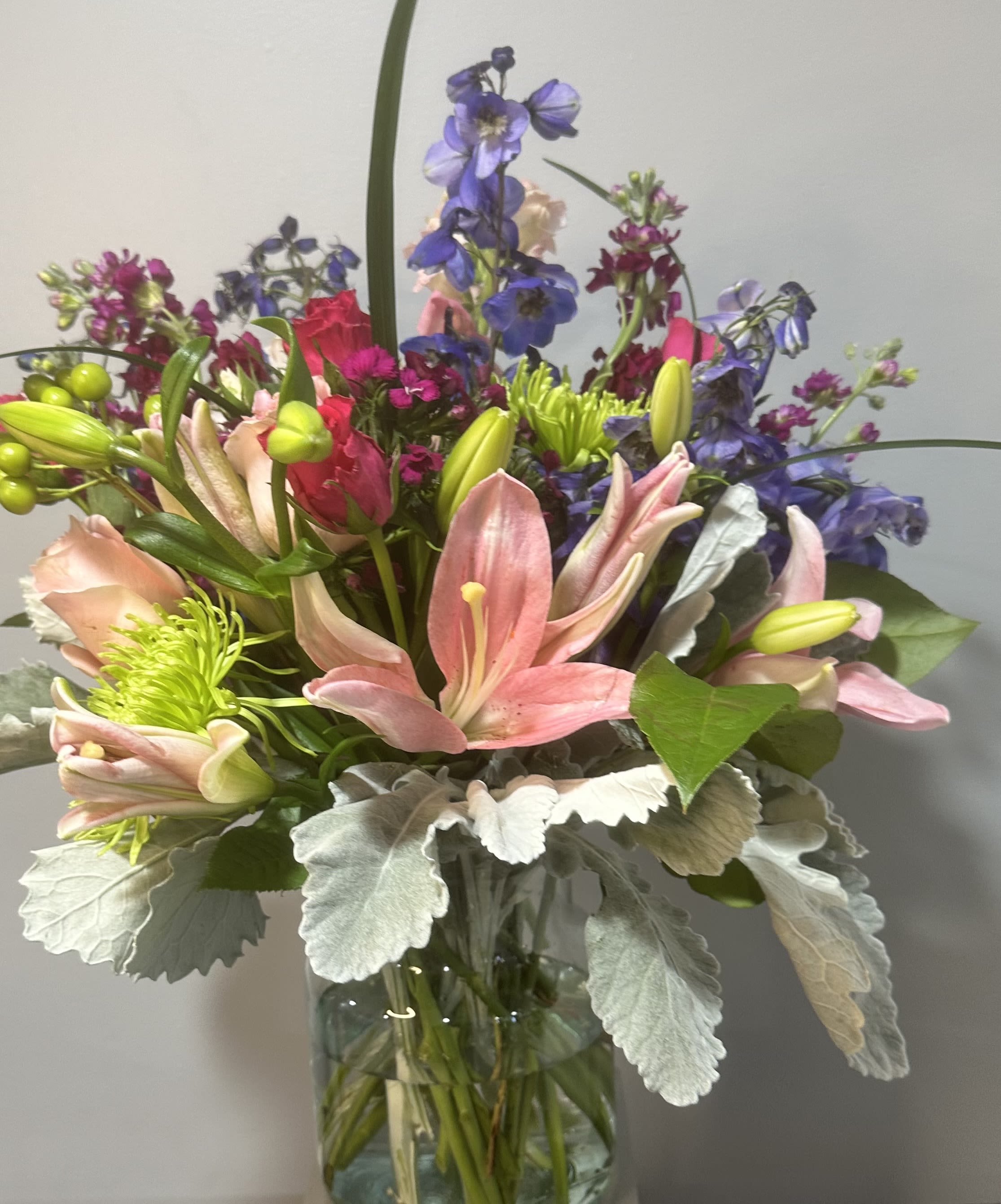 Brighter Day by Petals 2 Go - Brighten up the day with this mixed colorful bouquet with lilies, roses, stock and assorted greenery.