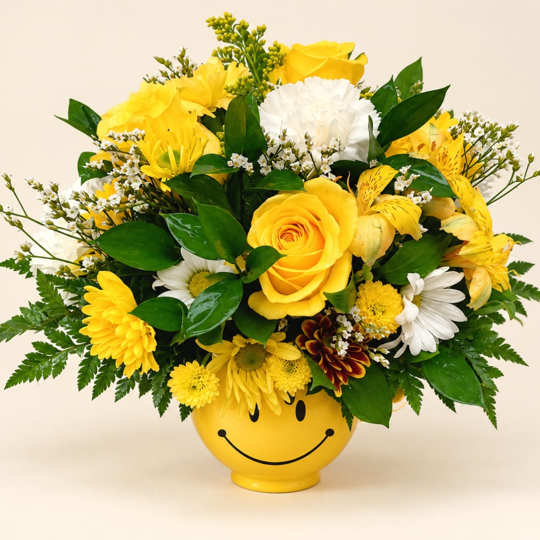 Yellow and white mixed bouquet in a smiley-face vase