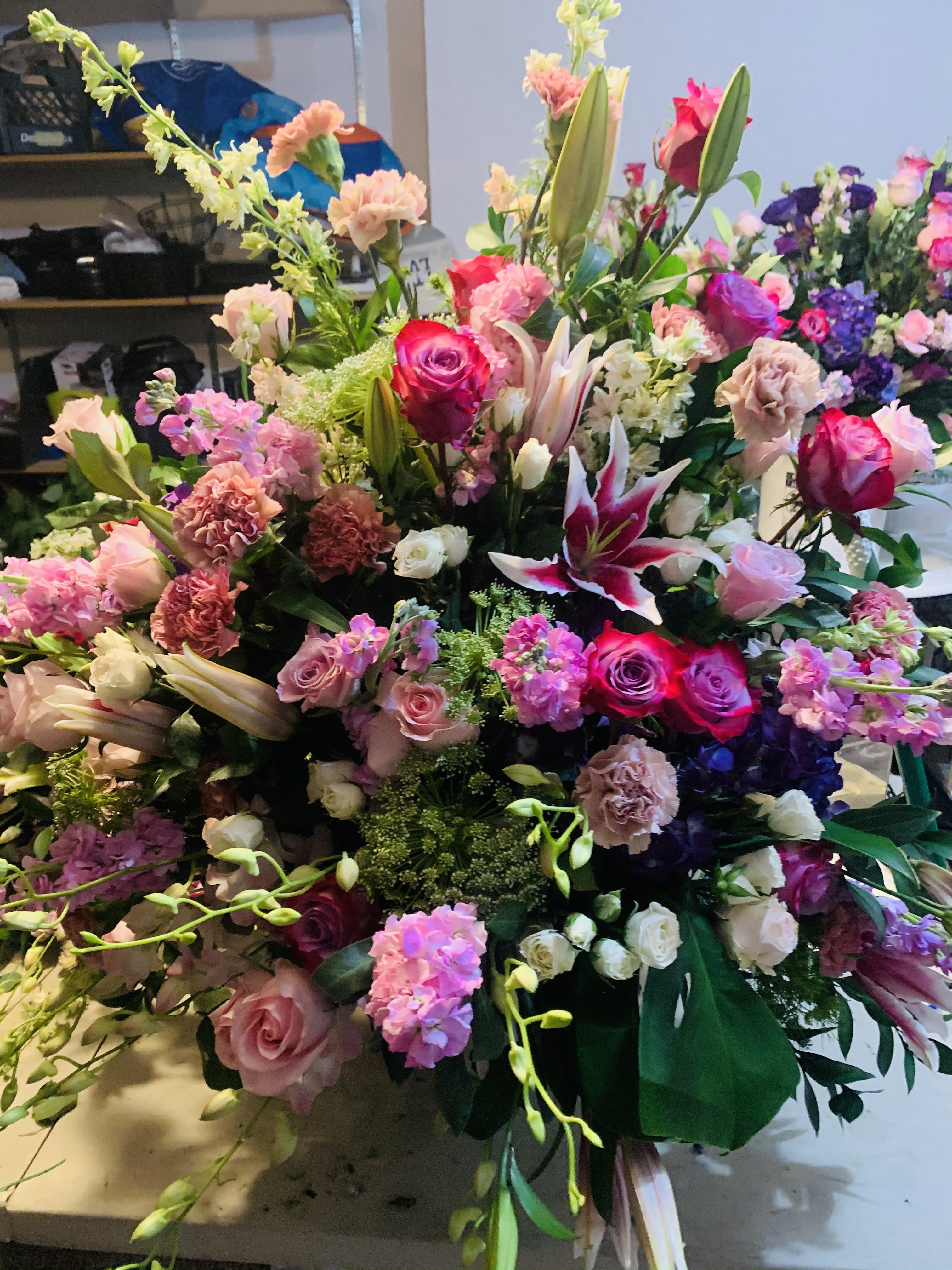 Large mixed bouquet with pink roses, lilies, and carnations