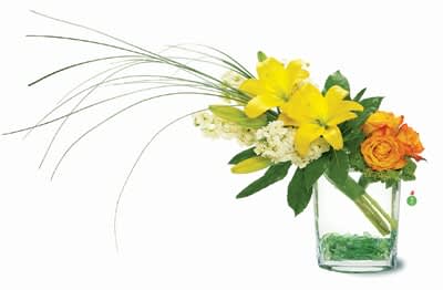 Artsy - Display your unique sense of style with this upscale arrangement, featuring a bright mix of yellow lilies, orange roses and bear grass, artfully arranged in a vase with glass pebbles. Send this fashionable gift to someone special. It’s sure to make an impression!