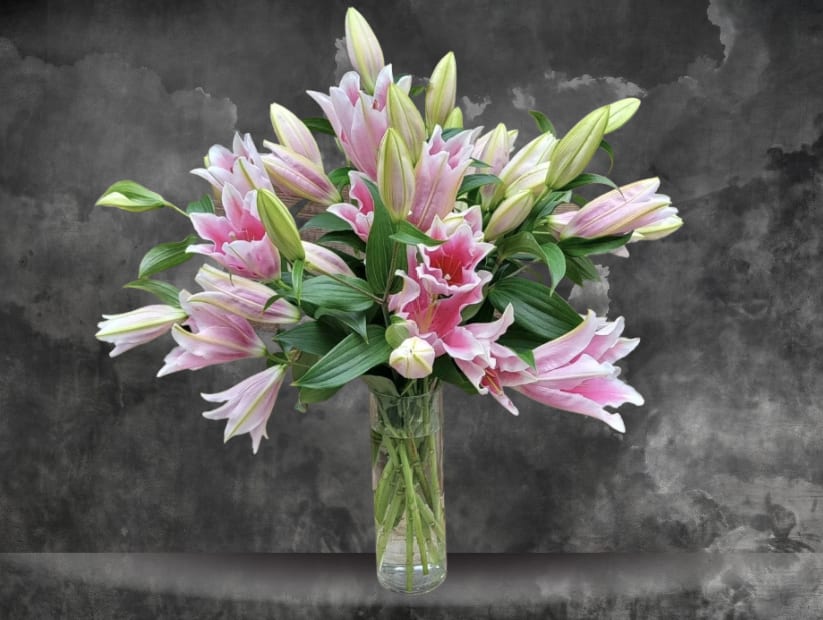 Lovely Lilies - This dramatic design features lovely Oriental lilies nestled in a glass vase. " Ooh-la-la!"
