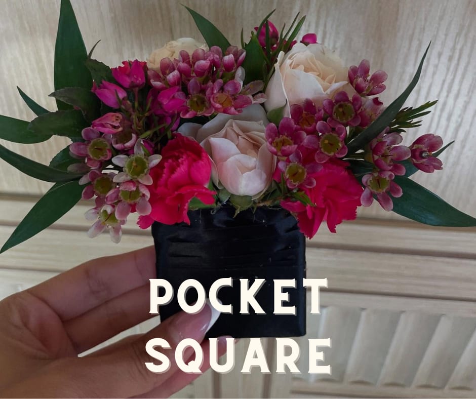 Small pocket square arrangement with pink and white flowers
