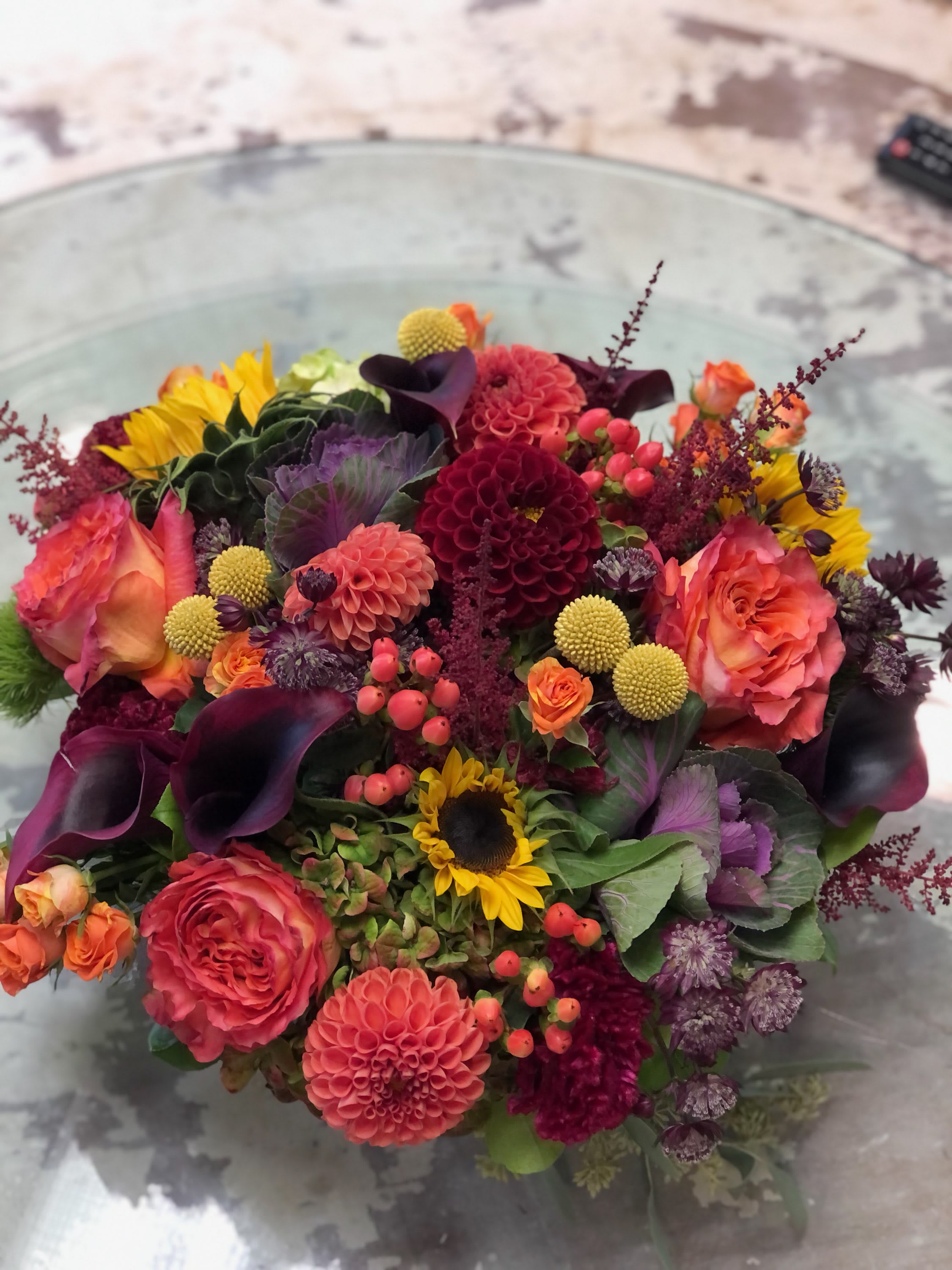 Colorful mixed bouquet with roses, dahlias, sunflowers, and calla lilies
