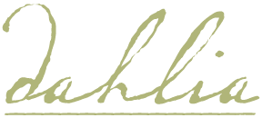 Stylized cursive signature in pale gold on a green background.
