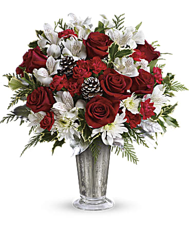 Red roses and white flowers in a silver vase