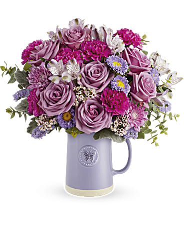 Lavender and pink bouquet in a purple mug vase