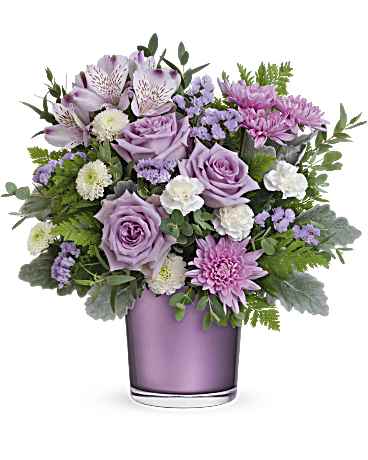 Lavender and pink bouquet in a purple glass vase