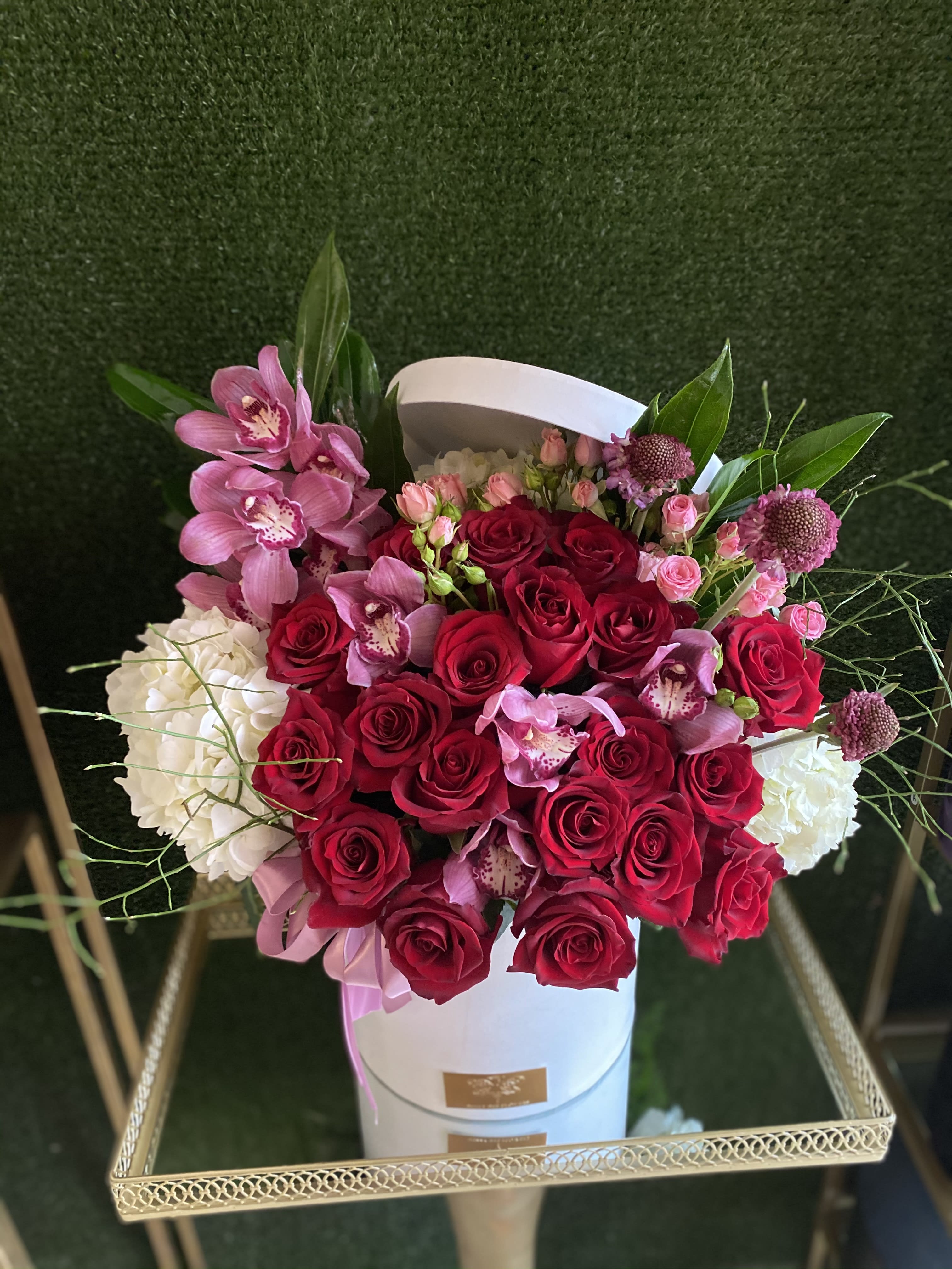 Fairytale - Reseda Florist - This beautiful arrangement is designed to deliver happiness to a loved ones day. Filled with beautiful Roses, Orchids and other beautiful flowers this box is customized to perfection, this arrangement is a showstopper! If you want to turn heads then this is the arrangement for you!