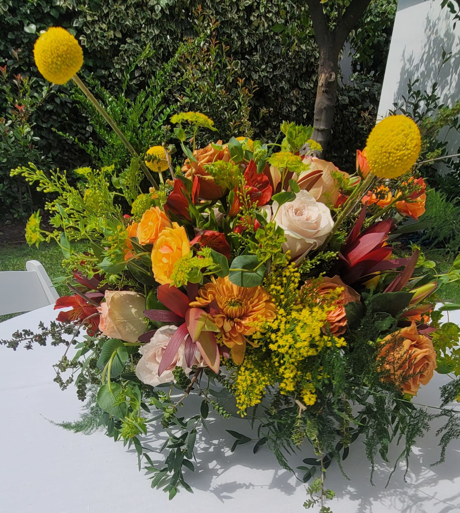 Large mixed bouquet with orange, white, and yellow flowers