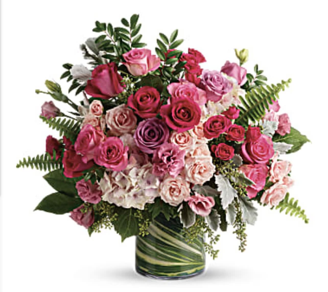 Pink and lavender rose bouquet in a glass vase
