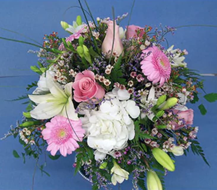 Mixed bouquet with pink gerberas, white lilies, and roses