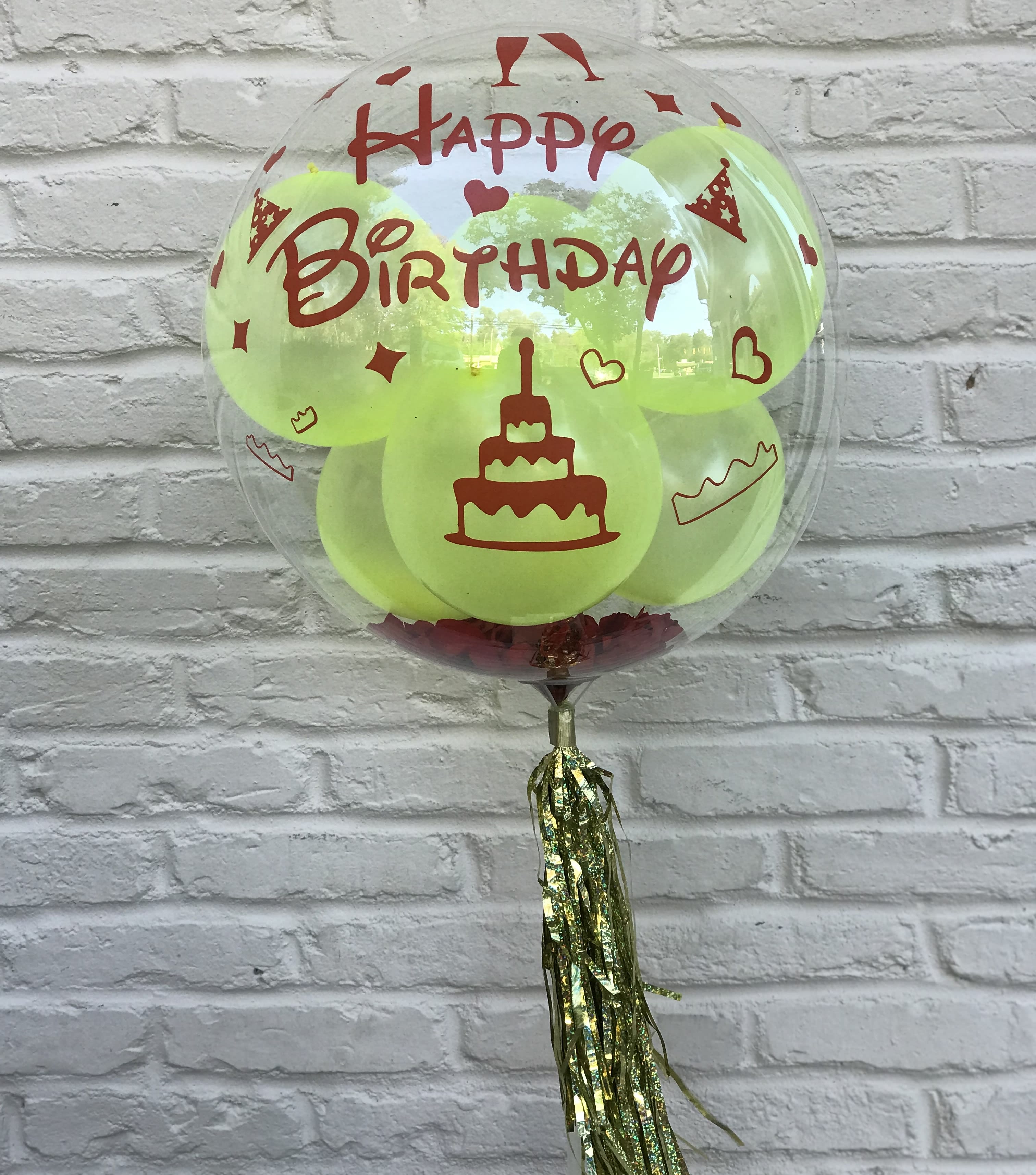 Happy Birthday Bobo Balloon - Clear balloon with six latex balloons inside.