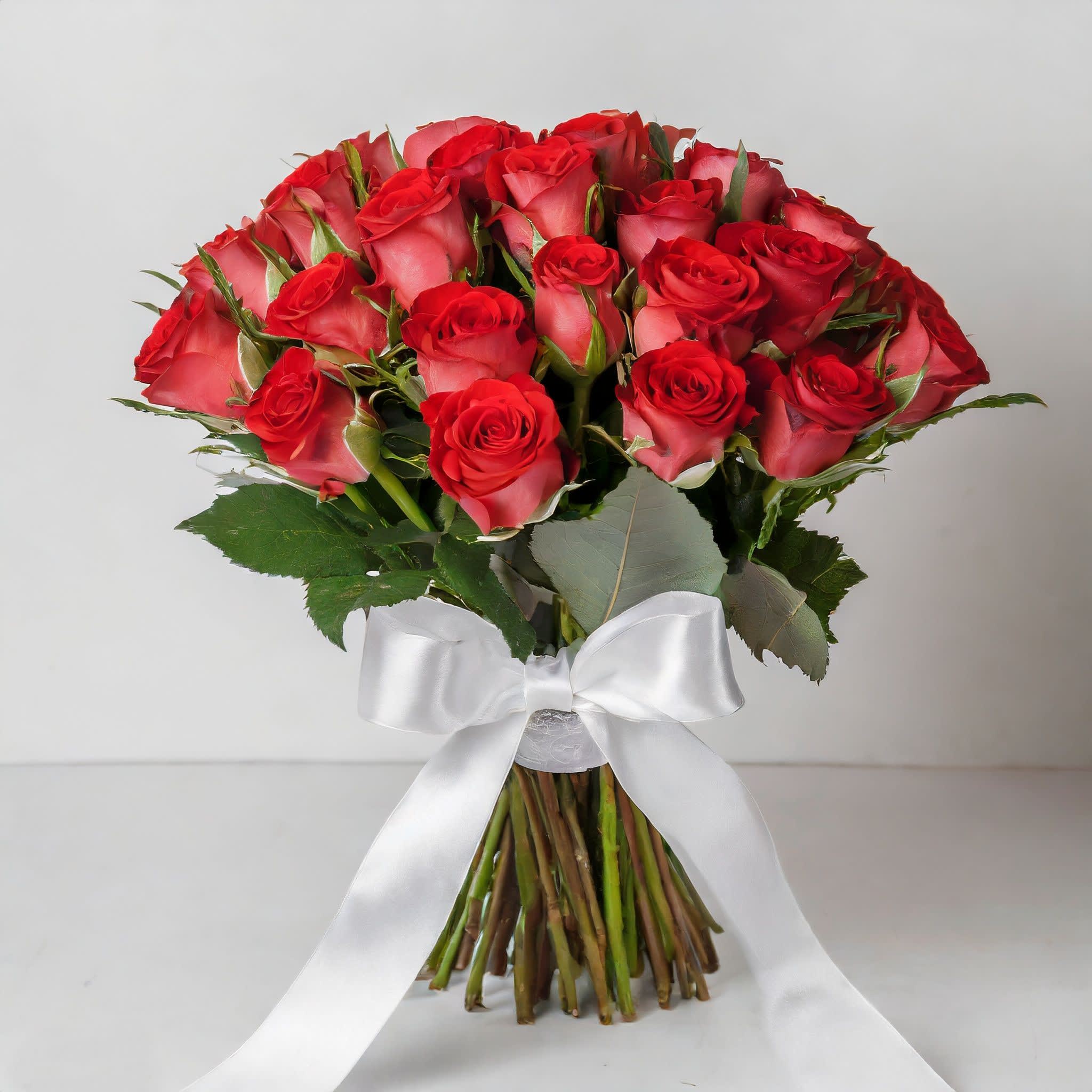 Bouquet of red roses tied with a white ribbon