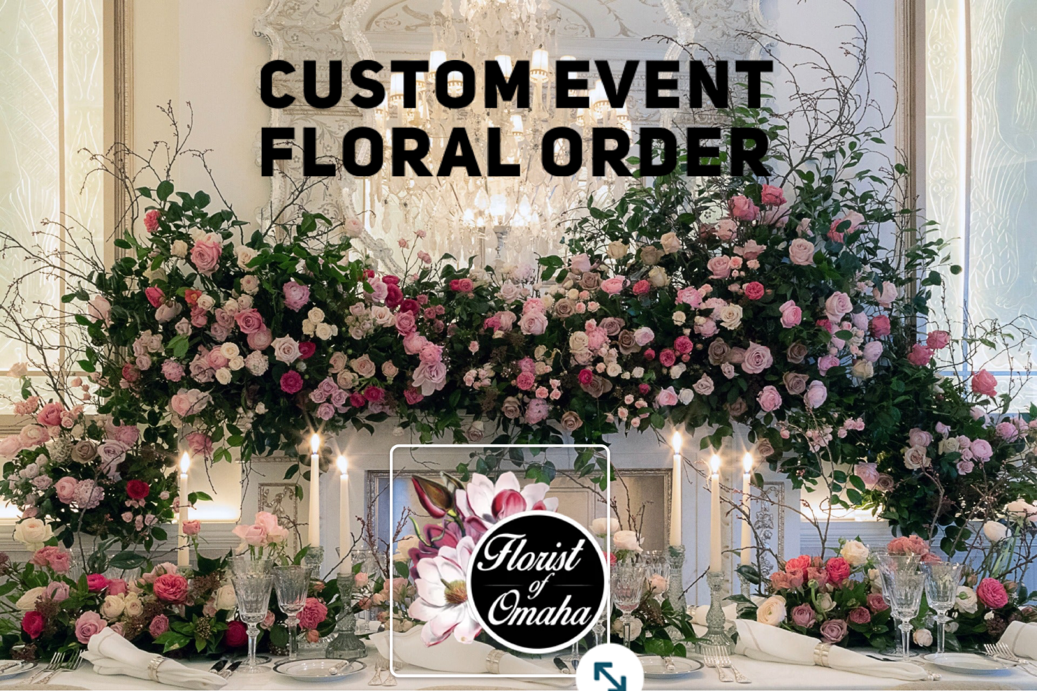 Large floral event display with pink and white roses and candles