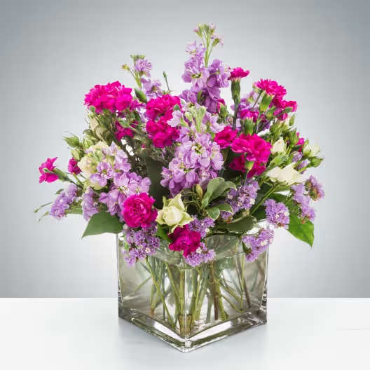 Twist and Shout by BloomNation™ - Flowers are fun! Especially when they look like this! Featuring sweet-smelling stock, spray roses, and carnations, this arrangement is a great surprise for Best Friends Day, Sister Day, or just because.  Approximate Dimensions: 10"D x 10"H