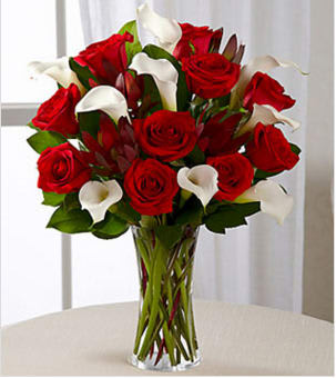 Memorable Moments Bouquet - Picked fresh from the farm to bring modern elegance into their everyday, our Memorable Moments Rose &amp; Mini Calla Lily Bouquet is blooming with gorgeous grace to celebrate love and life with each treasured bloom. Hand gathered in select floral farms and showcasing the winning color combination of red and white, this stunning flower arrangement has been picked fresh for you to help you celebrate a birthday, anniversary, or convey your message of heartfelt love and affection. This bouquet includes the following: red roses, white mini calla lilies, and an assortment of lush greens. Available with a selection of vases to fit your gifting needs. BETTER bouquet includes 19 stems with clear vase. Approximately 17"H x 15"W. Your purchase includes a complimentary personalized gift message.