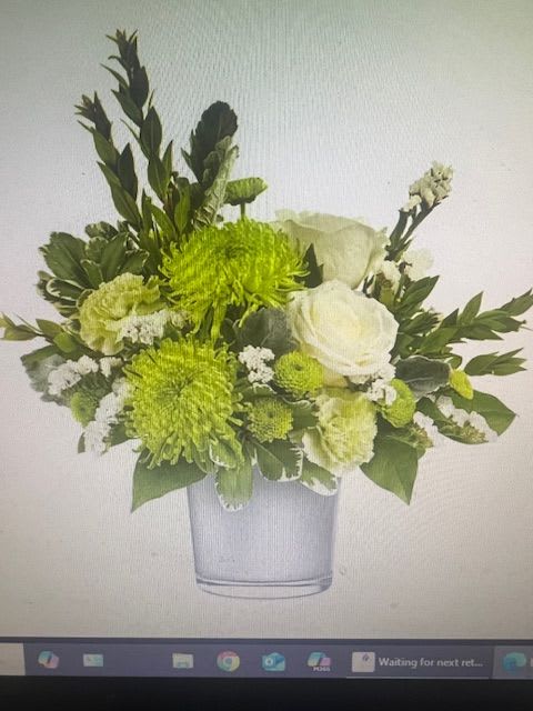 Positively Green - Bright green chrysanthemums with crisp white roses, green carnations for a fresh, modern arrangement . These soft colors create a peaceful bouquet for any occasion.  
