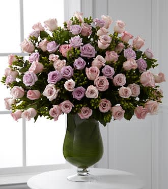 Applause Luxury Rose Bouquet - 24-inch Long-Stemmed Roses - They are the star of your life, a force of love that is simply endless. Shower them with your praise and gratitude symbolized through our exquisite bouquet of pink and lavender 24-inch premium long-stemmed roses offering their abundance of swirling petals gorgeously situated in a highly elegant 16-inch clear glass pedestal vase. Includes: 48 stems of 24-inch premium long-stemmed pink roses, 24 stems of 24-inch premium long-stemmed lavender roses, 36 stems of green hypericum berries, exotic foliage and a superior 16-inch clear glass pedestal vase. Approx. 34H x 27W