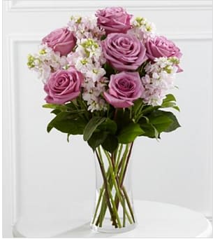 The FTD® All Things Bright™ Bouquet - The FTD® All Things Bright™ Bouquet offers warmth and comfort to your special recipient during this time of loss and grief. Gorgeous lavender roses are arranged amongst fragrant pink stock and lush greens, seated in a clear glass vase, to create a bouquet that beautifully conveys your deepest sympathies. GOOD bouquet includes 11 stems. Approximately 18"H x 12"W. BETTER bouquet includes 16 stems. Approximately 19"H x 14"W. BEST bouquet includes 21 stems. Approximately 20"H x 15"W. Your purchase includes a complimentary personalized gift message.