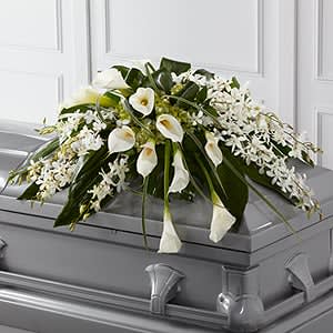 White floral casket spray with calla lilies and orchids