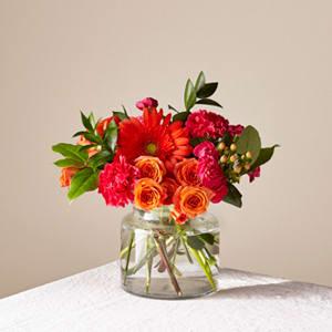 Bright mixed bouquet in a clear glass vase
