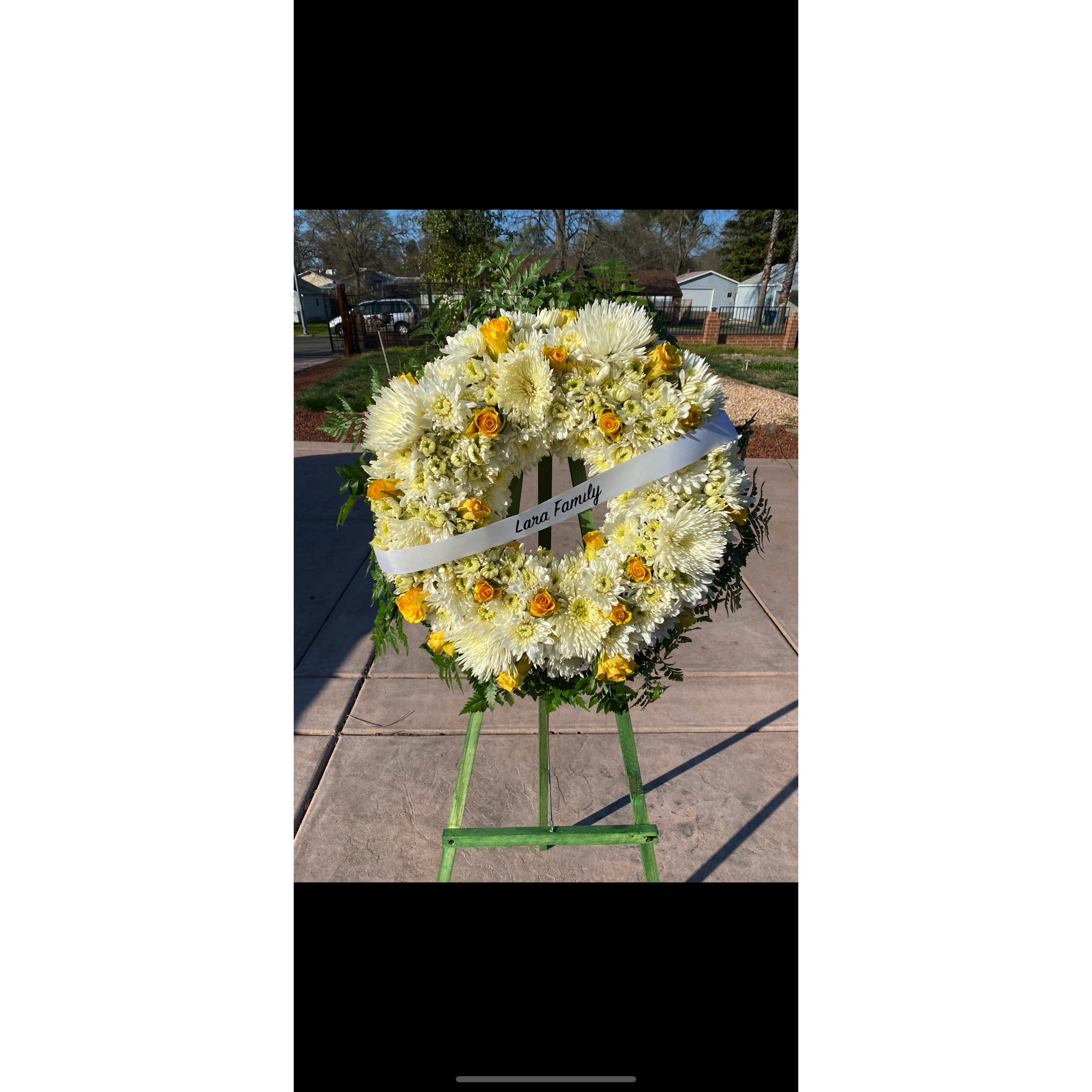 Pop of color funeral arrangement - white with any color rose for someone special. Choose your color in special instructions or whatever is available will be used.