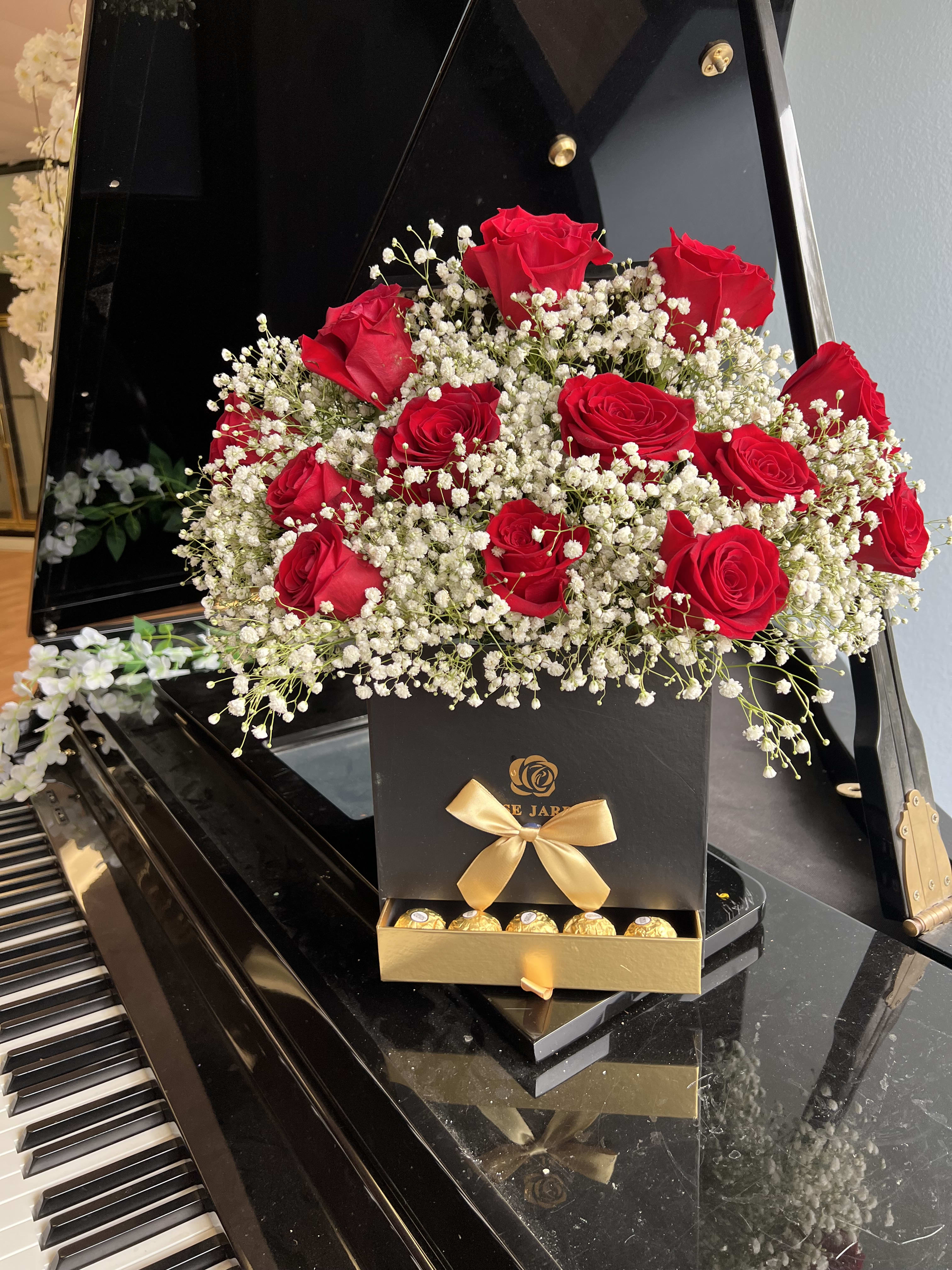 Roses and chocolates - box of roses, babies breath and chocolates added 