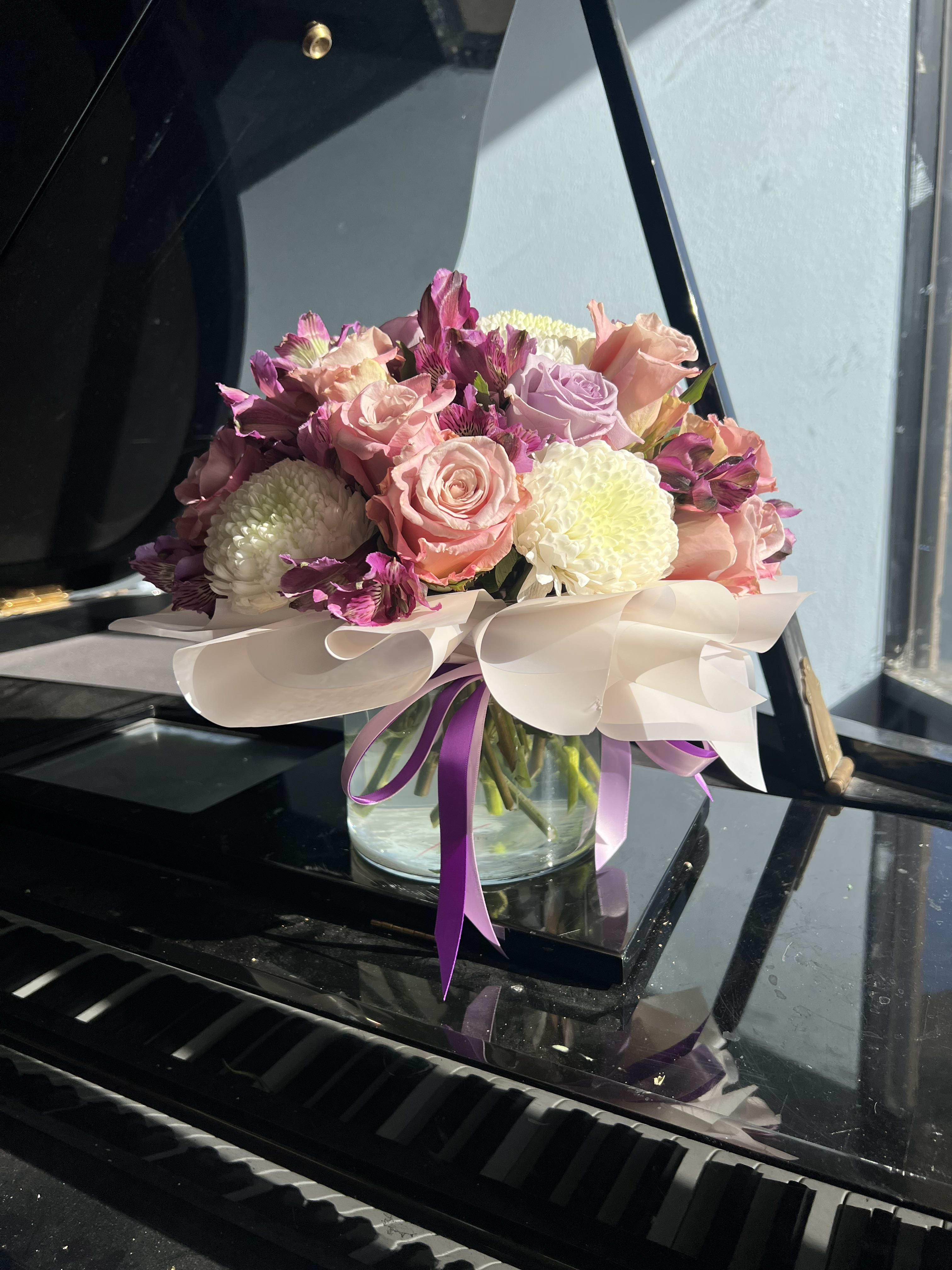 Round Vase arrangement - pink and purple mix of flowers in a vase