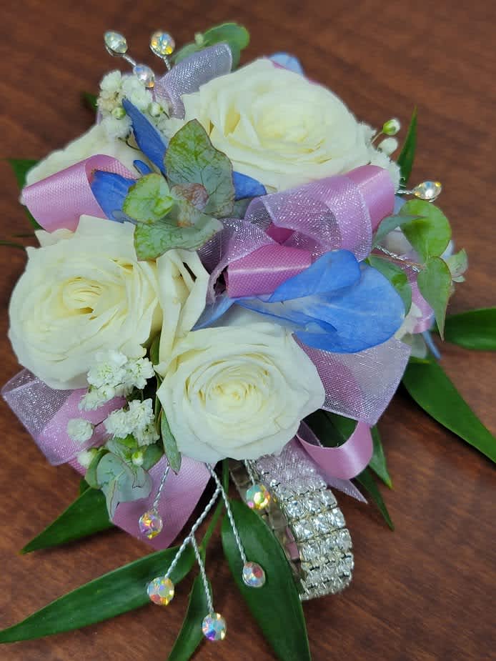 White rose bouquet with pink and blue ribbons and crystal accents