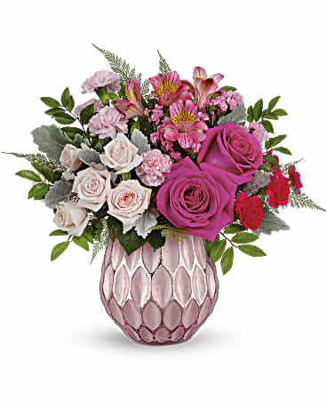 Pink and white mixed bouquet in a textured pink vase