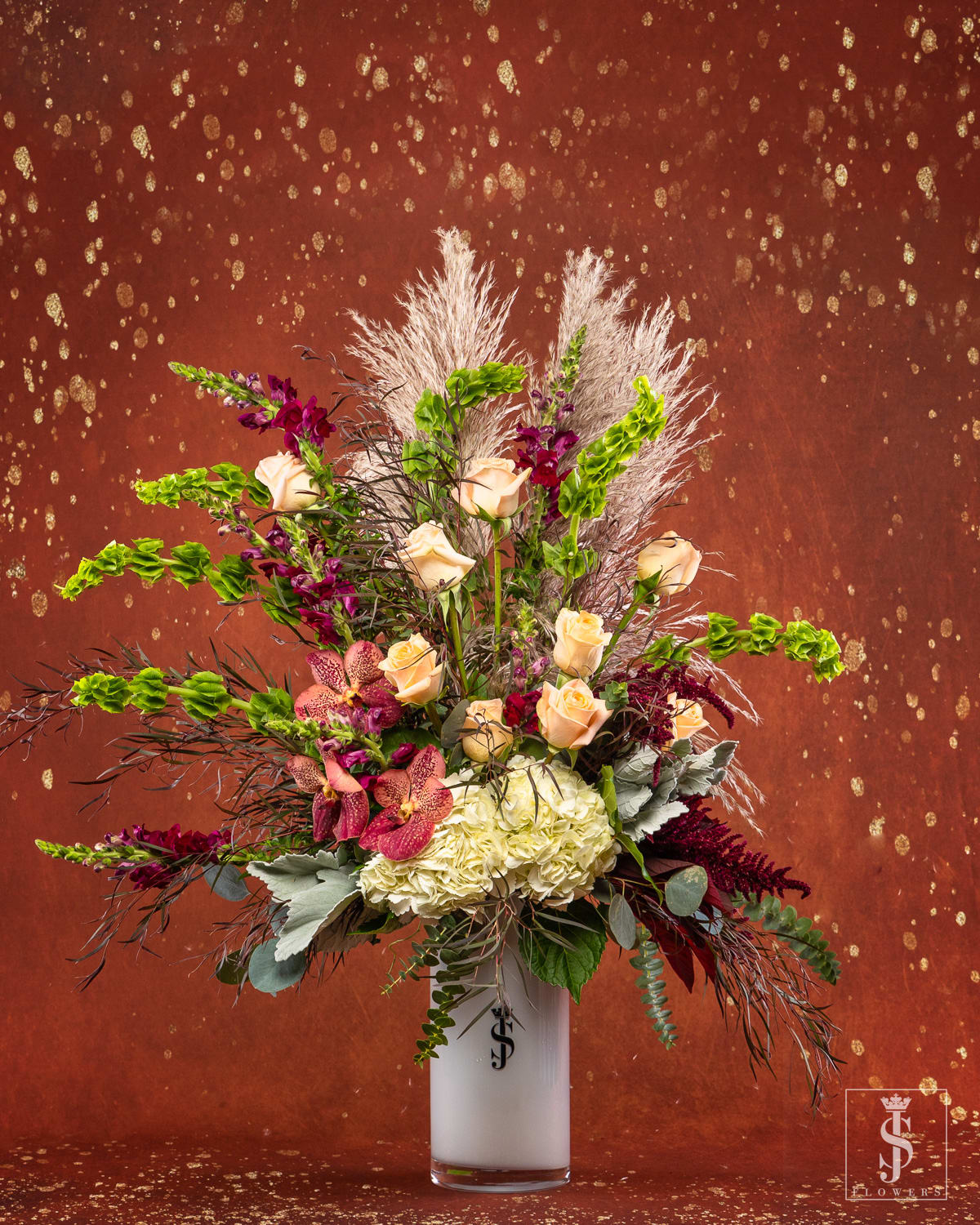 Russet Falls (Mix w/Doz Roses) - Our Russet Falls Dozen of Roses bouquet captures all the wonder of the season. Soft Pink and peach roses are blended with natural accents of pompous grass, complimented with white hydrangea. Whether used for holding fresh flowers, plants or as part of the décor, this gift adds warmth and charm to the home year after year.