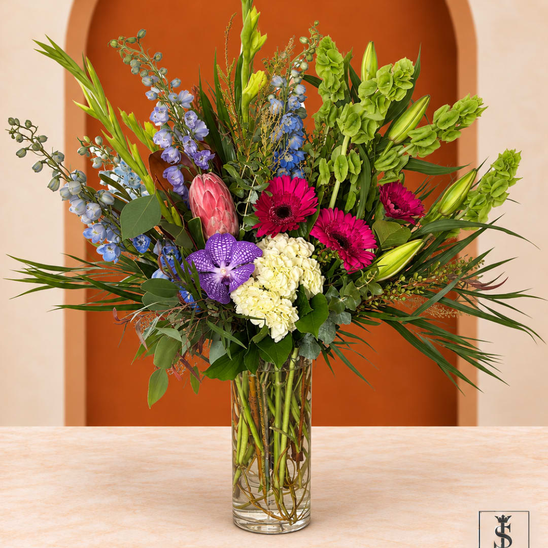 Colorful mixed bouquet in a clear glass vase
