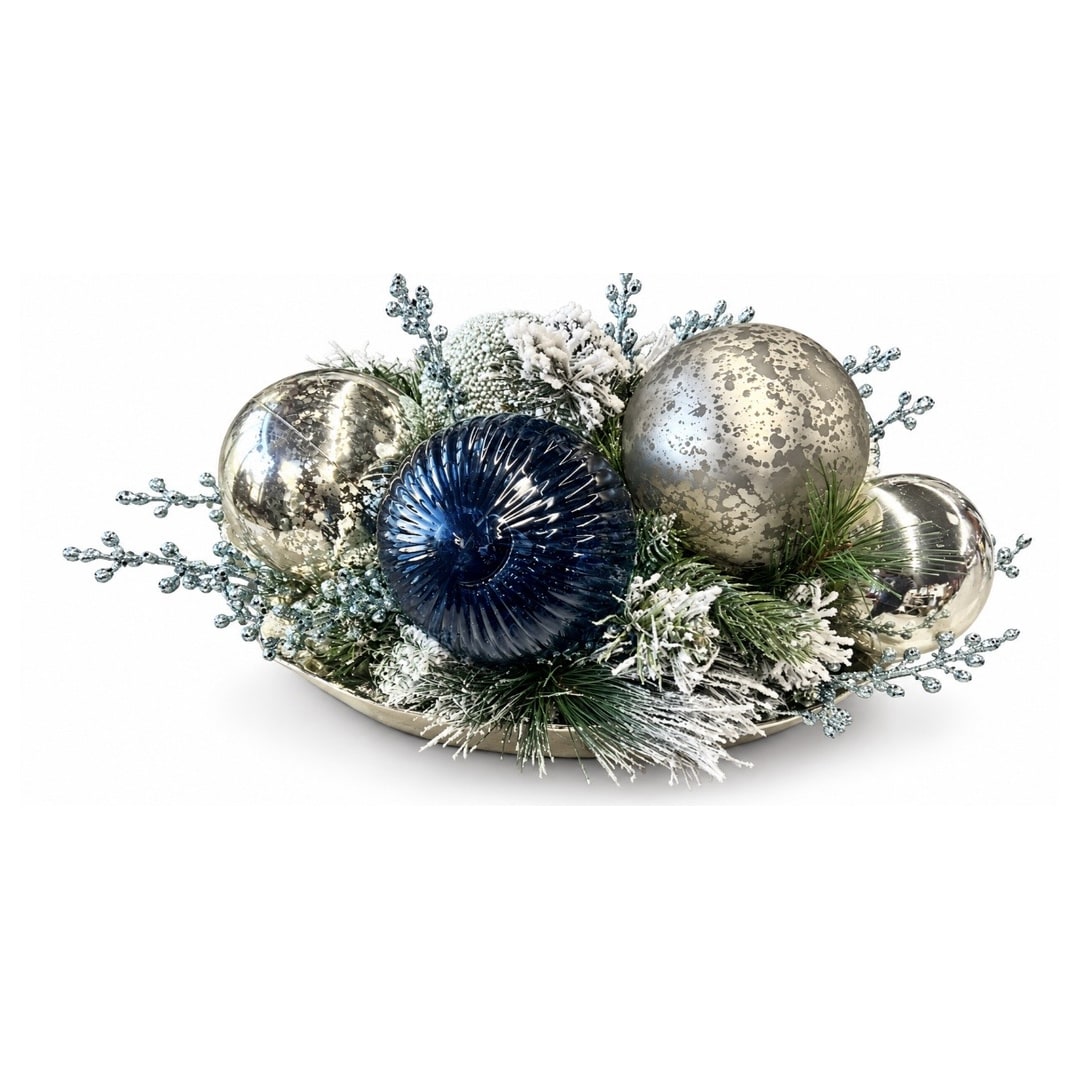 Holiday centerpiece with metallic ornaments and frosted greenery