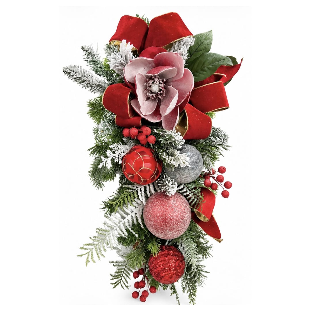 Christmas floral swag with red bows, frosted greenery, and ornaments