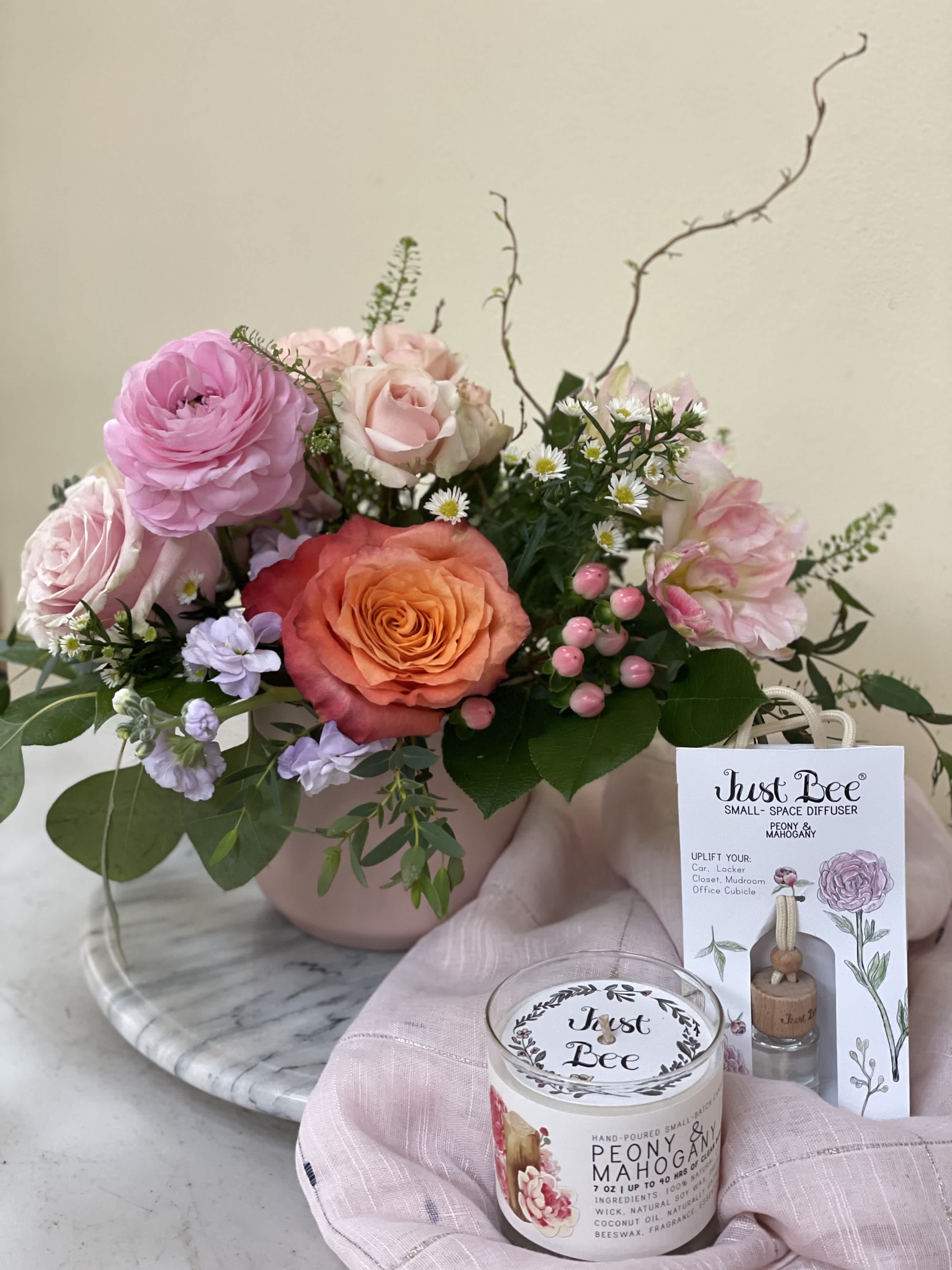 Pink and peach rose bouquet in a blush vase with a candle and diffuser gift set