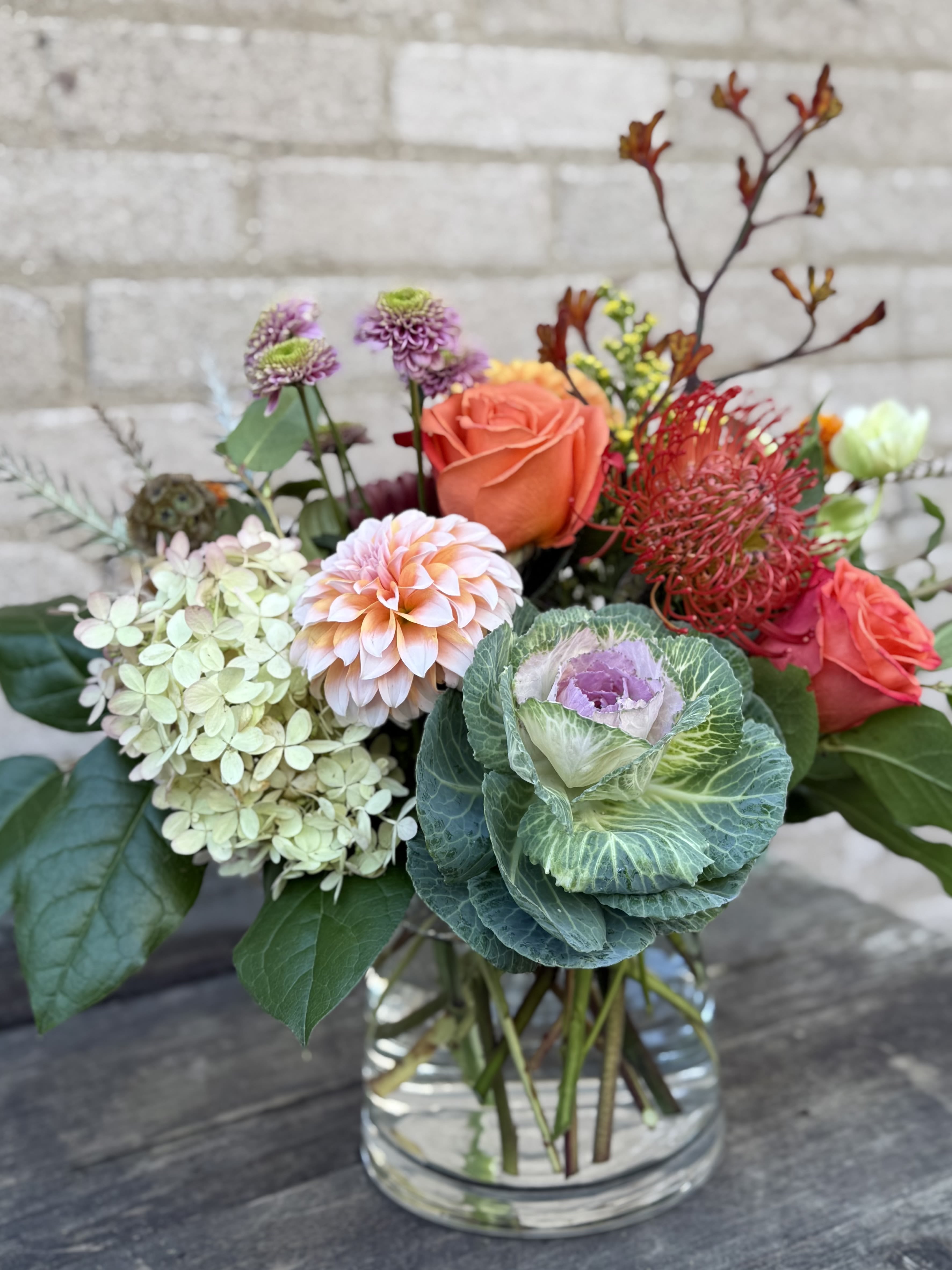 Autumn Sage - A beautiful pastel Fall arrangement, we design with interesting blooms and greens, our arrangement may differ to the photo as our selection of blooms change with the season but it will be a design as close to the picture as possible.