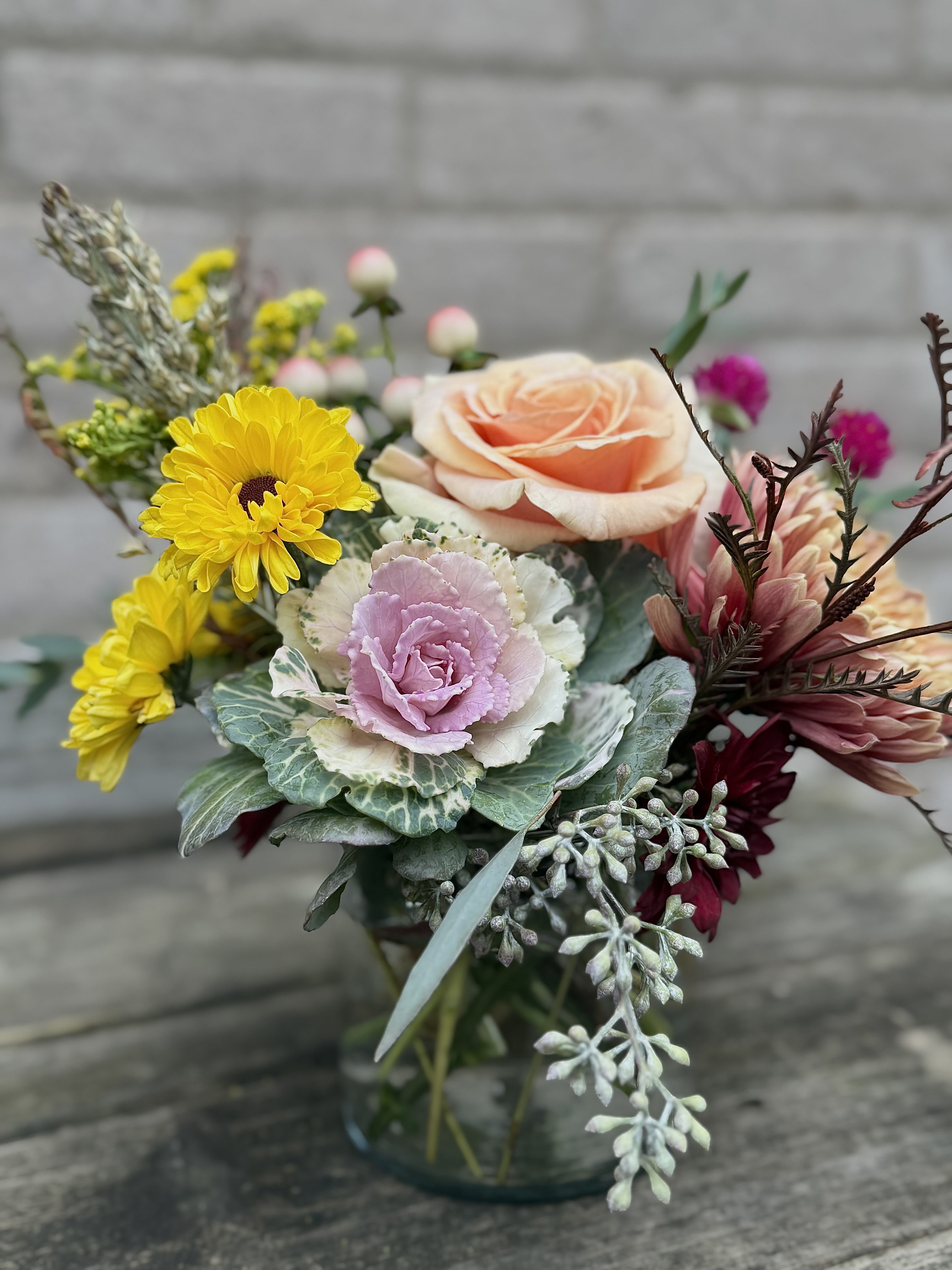 Soft Fall - A beautifully designed interesting, fall arrangement, perfect for a desk small table or Nursing home small table or as a gift for a perfect host. Blooms may be different to the picture as our blooms change with the season but will resemble the picture as closely as possible.