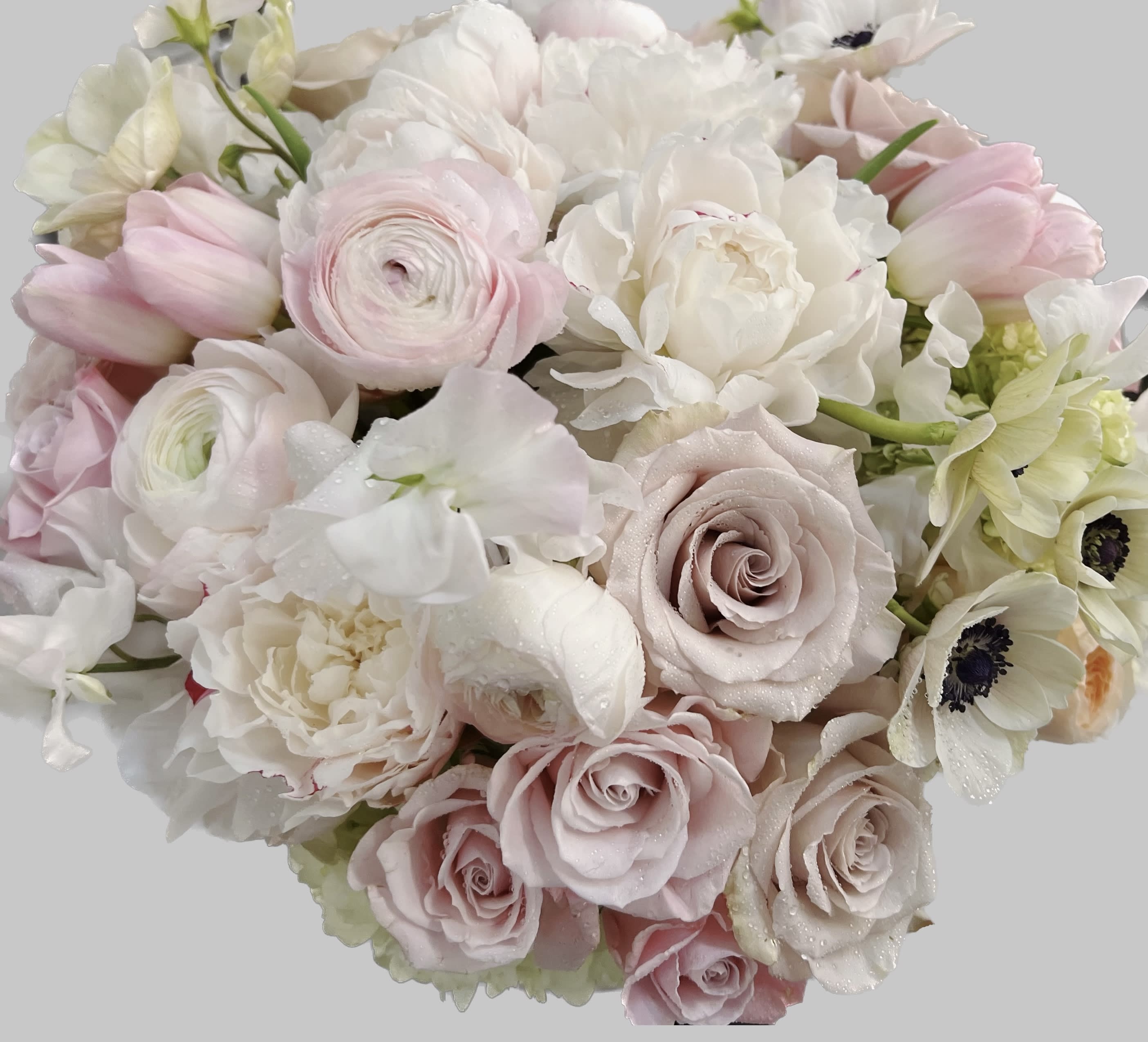 Bouquet of pale pink and white roses with white blooms